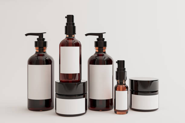Set of amber hair oil and cream bottles with blank label mockups