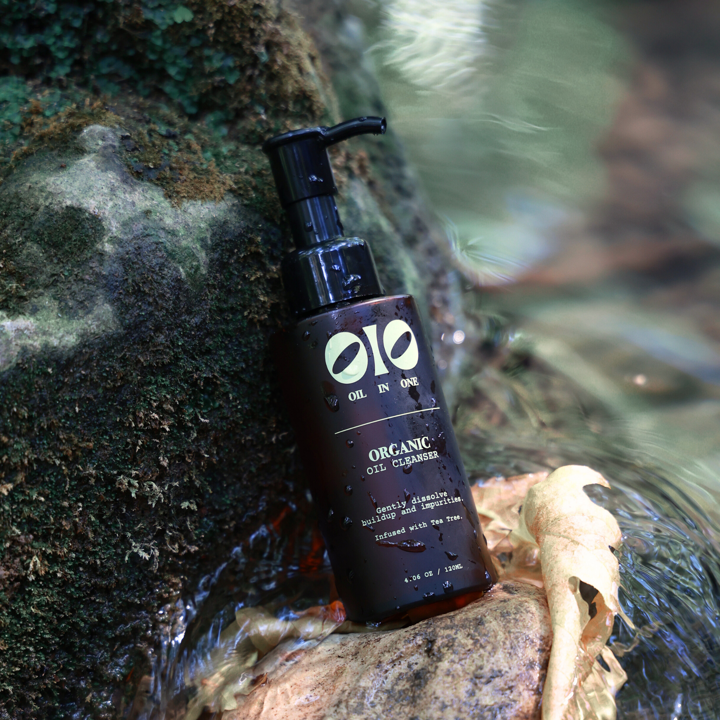 Olio Organic Oil Cleanser bottle on a natural background