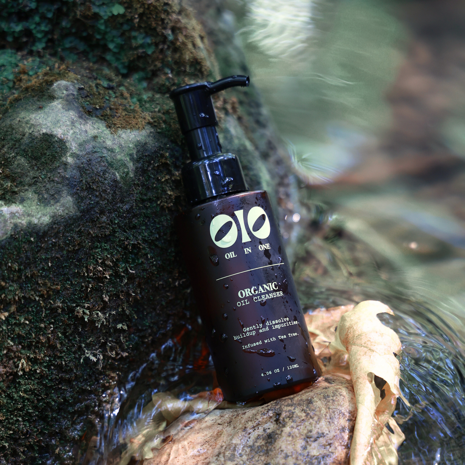 Olio Organic Oil Cleanser bottle on a natural background