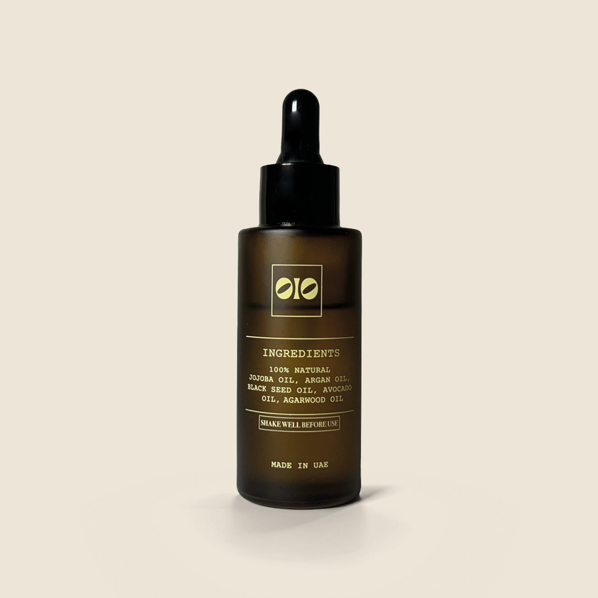 Skincare serum bottle with dropper on a beige background